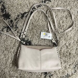 Genuine leather purse with studs and tassels